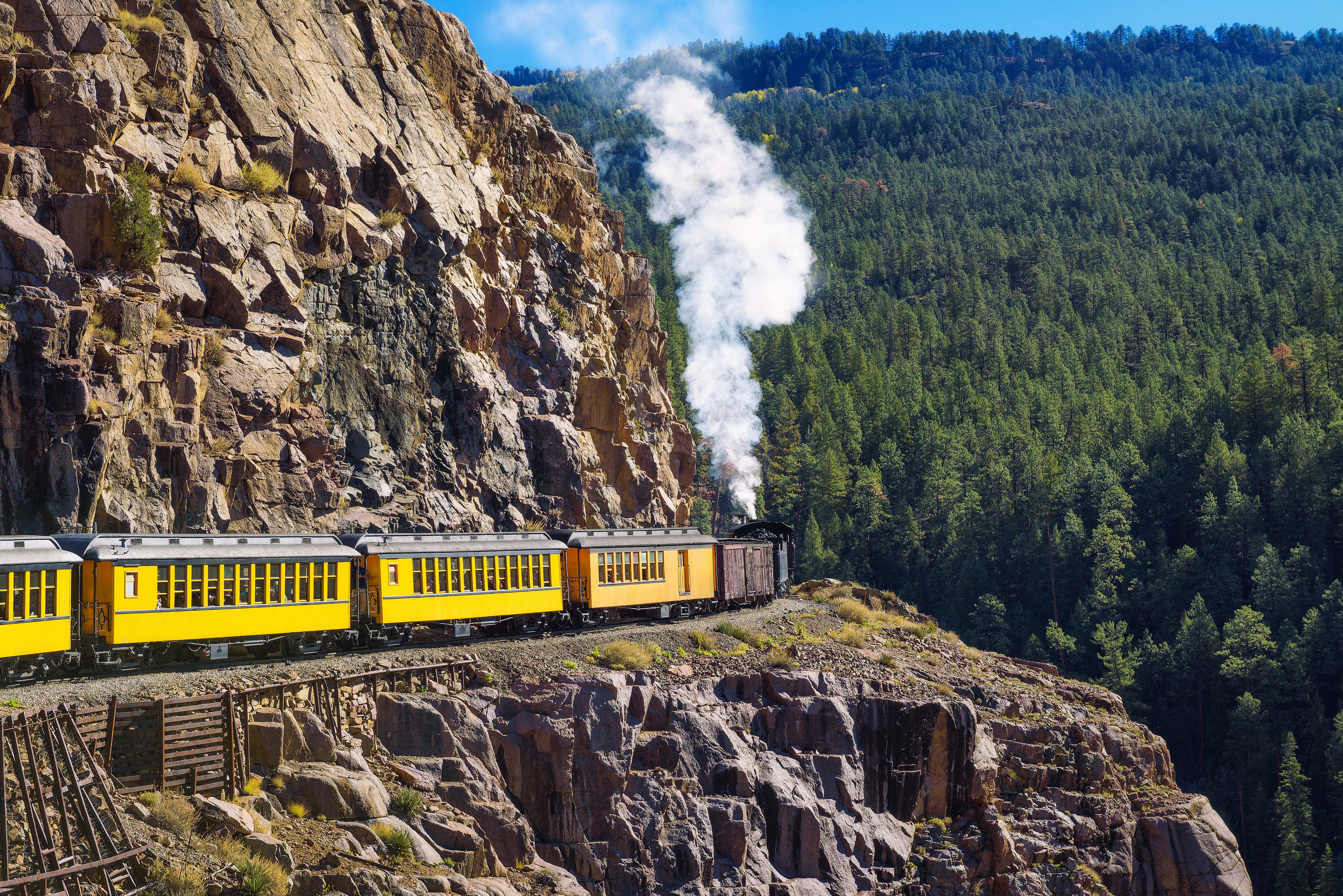 Historic steam engine train travels through the San Juan Mountains in Colorado.