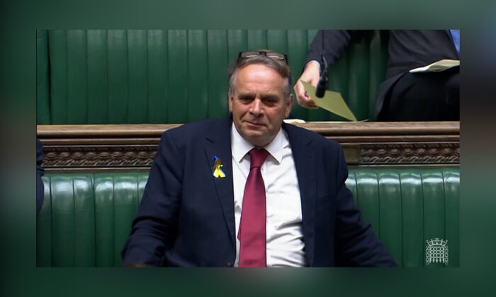 Conservative MP for Tiverton and Honiton Neil Parish sitting in Parliament in Westminster, London, on April 28, 2022. (House of Commons/Screenshot via The Epoch Times)
