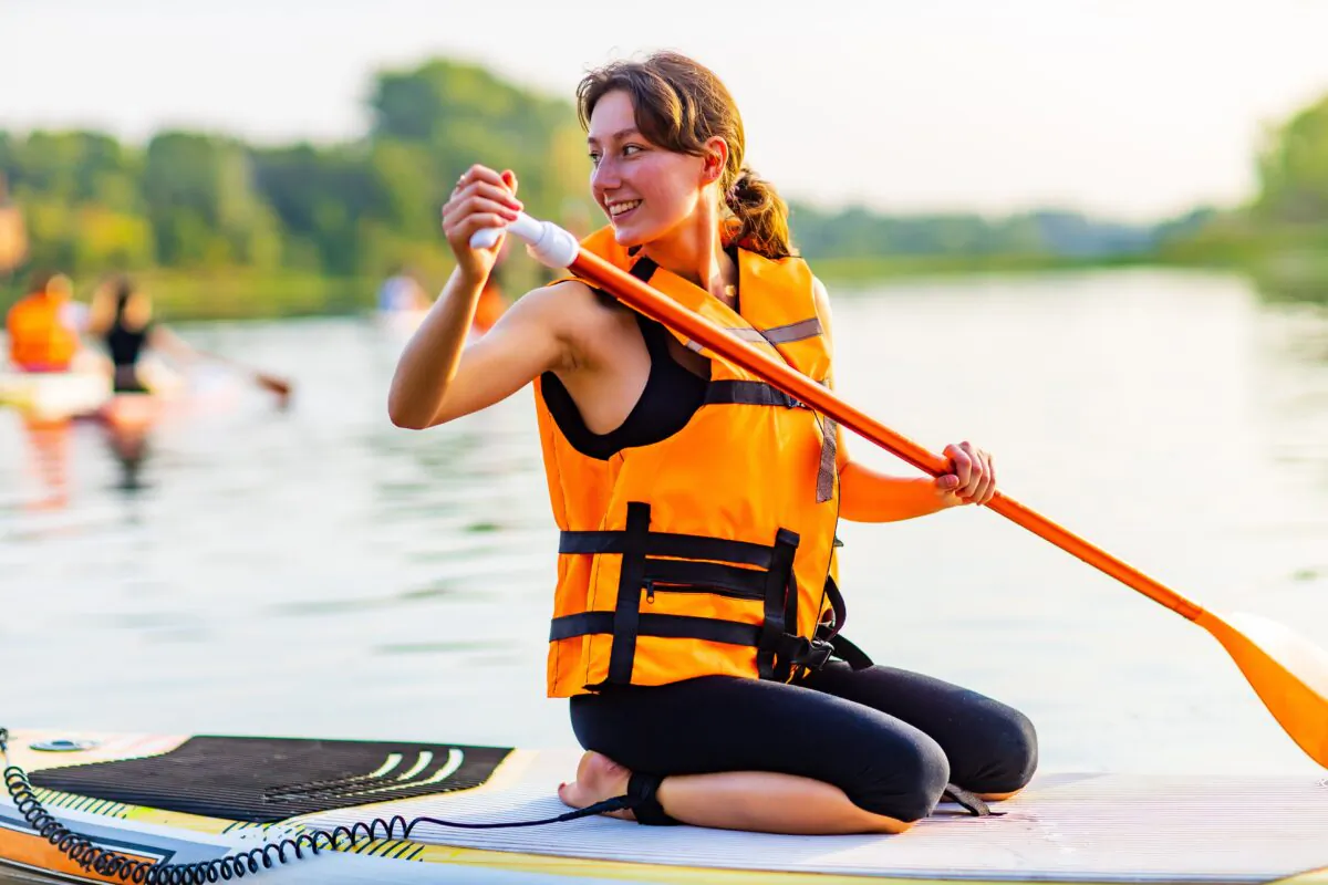 Paddleboarding is a great vacation sport as you can enjoy the outdoors and keep cool when the weather is hot. (yurakrasil/Shutterstock)