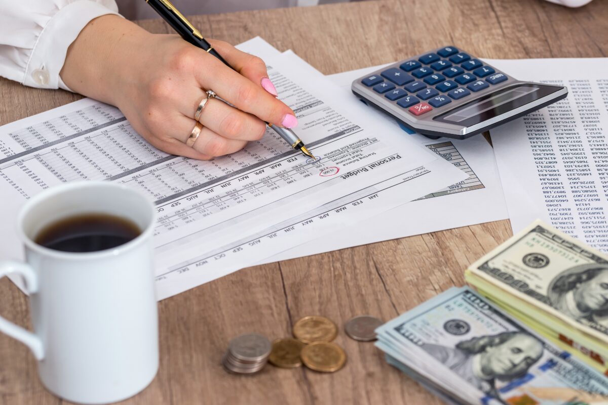 This picture shows a person calculating their tax return (RomanR/Shutterstock)