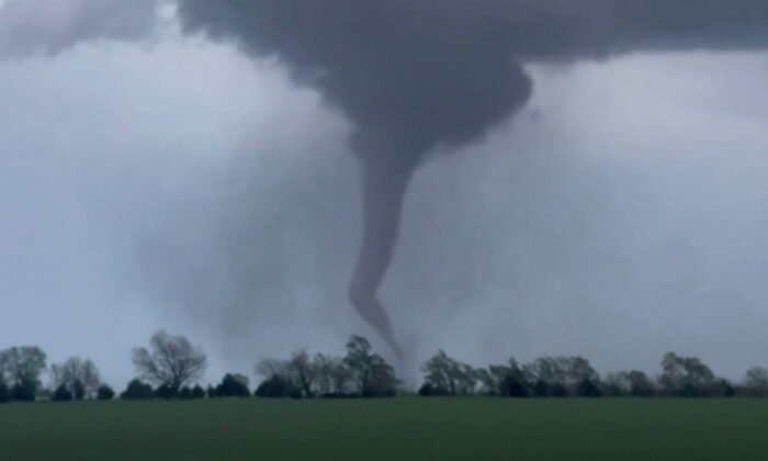 A tornado rips through Andover, Kan., on April 29, 2022, in a still from video. (Corey Novascone/@cfromtheict via AP/Screenshot via The Epoch Times)