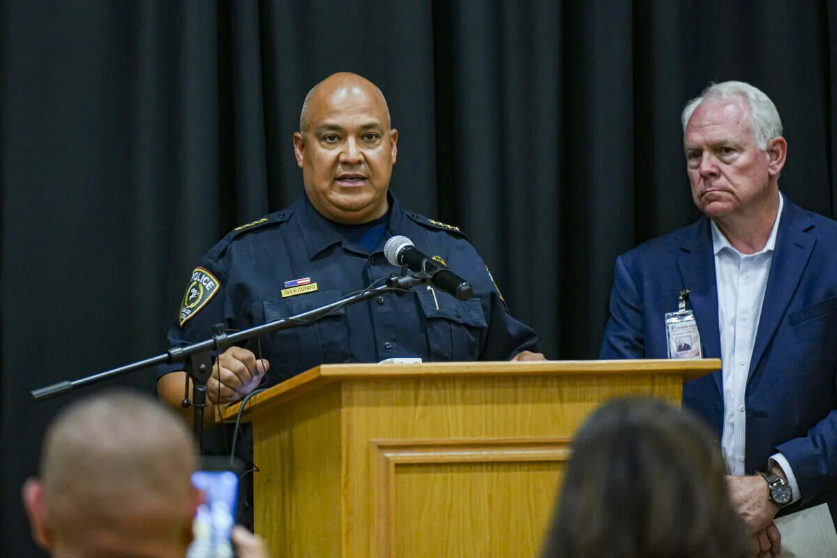 Pete Arredondo, chief of police for the Uvalde Consolidated Independent School District (L), speaks at a press conference while Superintendent Hal Harrell looks on, following a mass school shooting in Uvalde, Texas, on May 24, 2022. (Charlotte Cuthbertson/The Epoch Times)