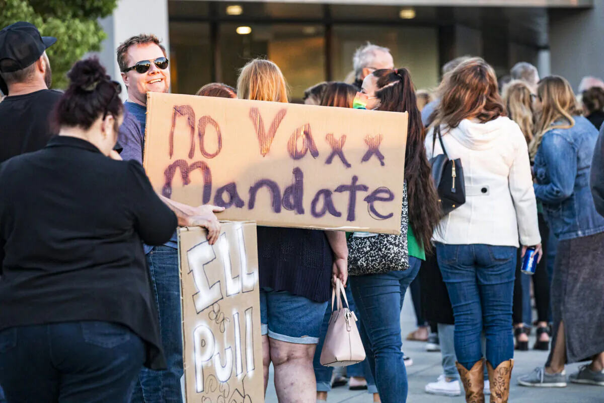 In this file photo, parents gather to express their concerns over vaccine mandates for students at the Placentia Yorba Linda Unified School District building in Placentia, Calif., on Oct. 12, 2021. (John Fredricks/The Epoch Times)
