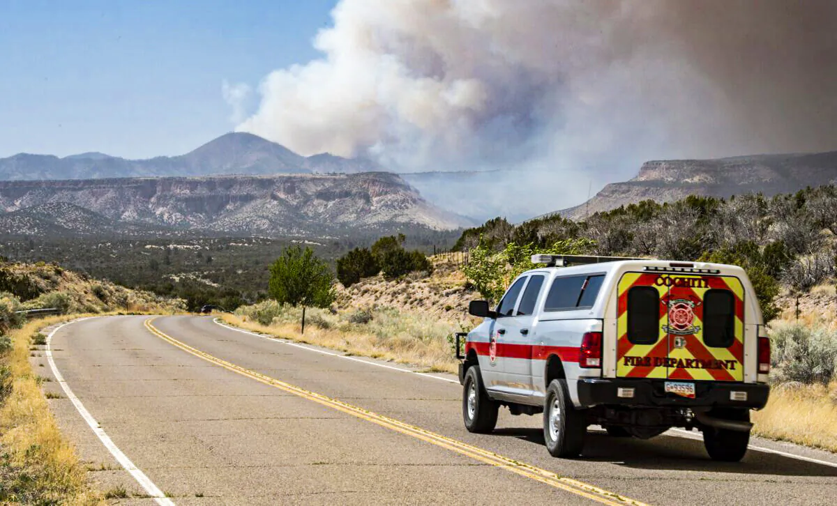 A Cochiti Fire Department vehicle heads towards a plume of smoke from the Cerro Pelado Fire burning in the Jemez Mountains, in in Cochiti, N.M., on April 29, 2022. (Robert Browman//The Albuquerque Journal via AP)
