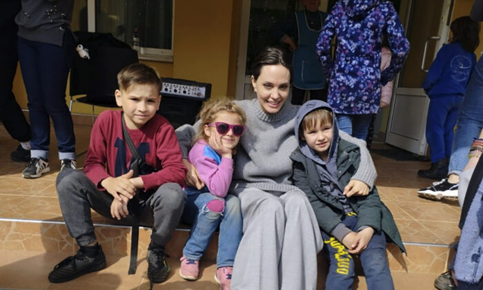 Hollywood movie star and UNHCR Goodwill Ambassador Angelina Jolie will take a picture with her children in Lviv, Ukraine, on April 30, 2022.  (Maxim Koztsky / Lviv City Hall via AP)
