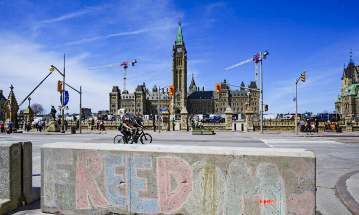 Chalk art asking for freedom is seen across the street from Parliament Hill in downtown Ottawa on May 1, 2022. (The Canadian Press/Sean Kilpatrick)