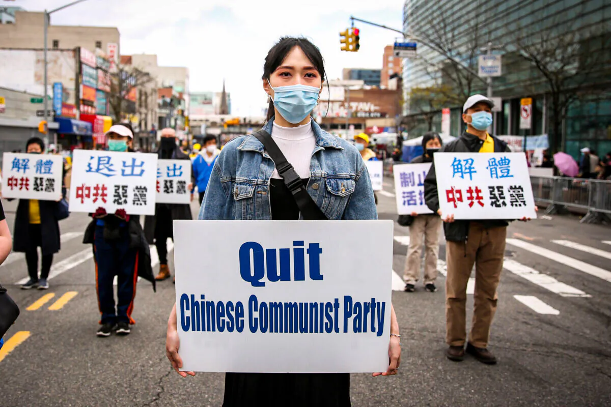 Falun Gong practitioners take part in a parade in Flushing, New York, on April 18, 2021, to commemorate the 22nd anniversary of the April 25th peaceful appeal of 10,000 Falun Gong practitioners in Beijing. (Samira Bouaou/The Epoch Times)