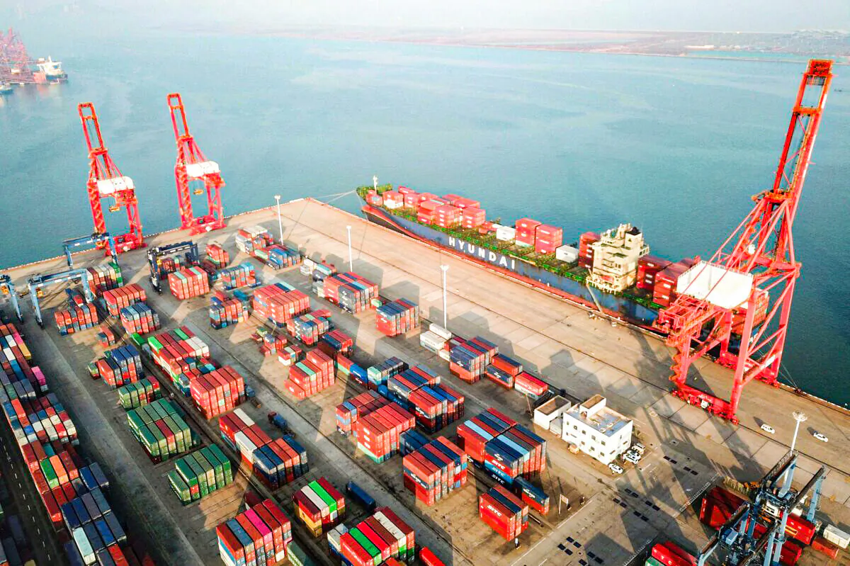 This aerial photo taken on Dec. 7, 2021 shows containers and gantry cranes at a port in Lianyungang in China's eastern Jiangsu province. (STR/AFP via Getty Images)