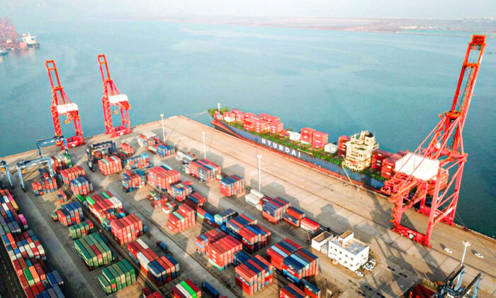 This aerial photo taken on Dec. 7, 2021 shows containers and gantry cranes at a port in Lianyungang in China's eastern Jiangsu province. (STR/AFP via Getty Images)