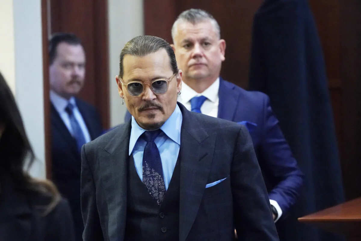 Actor Johnny Depp arrives in the courtroom after lunch, at the Fairfax County Circuit Court in Fairfax, Va., on May 2, 2022. (Steve Helber/Pool via AP)