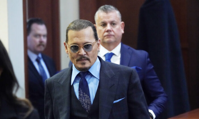 Actor Johnny Depp arrives in the courtroom after lunch, at the Fairfax County Circuit Court in Fairfax, Va., on May 2, 2022. (Steve Helber/Pool via AP)