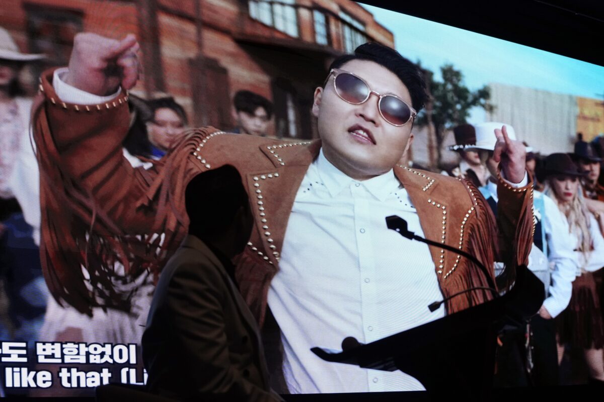 South Korean singer PSY watches his new music videos