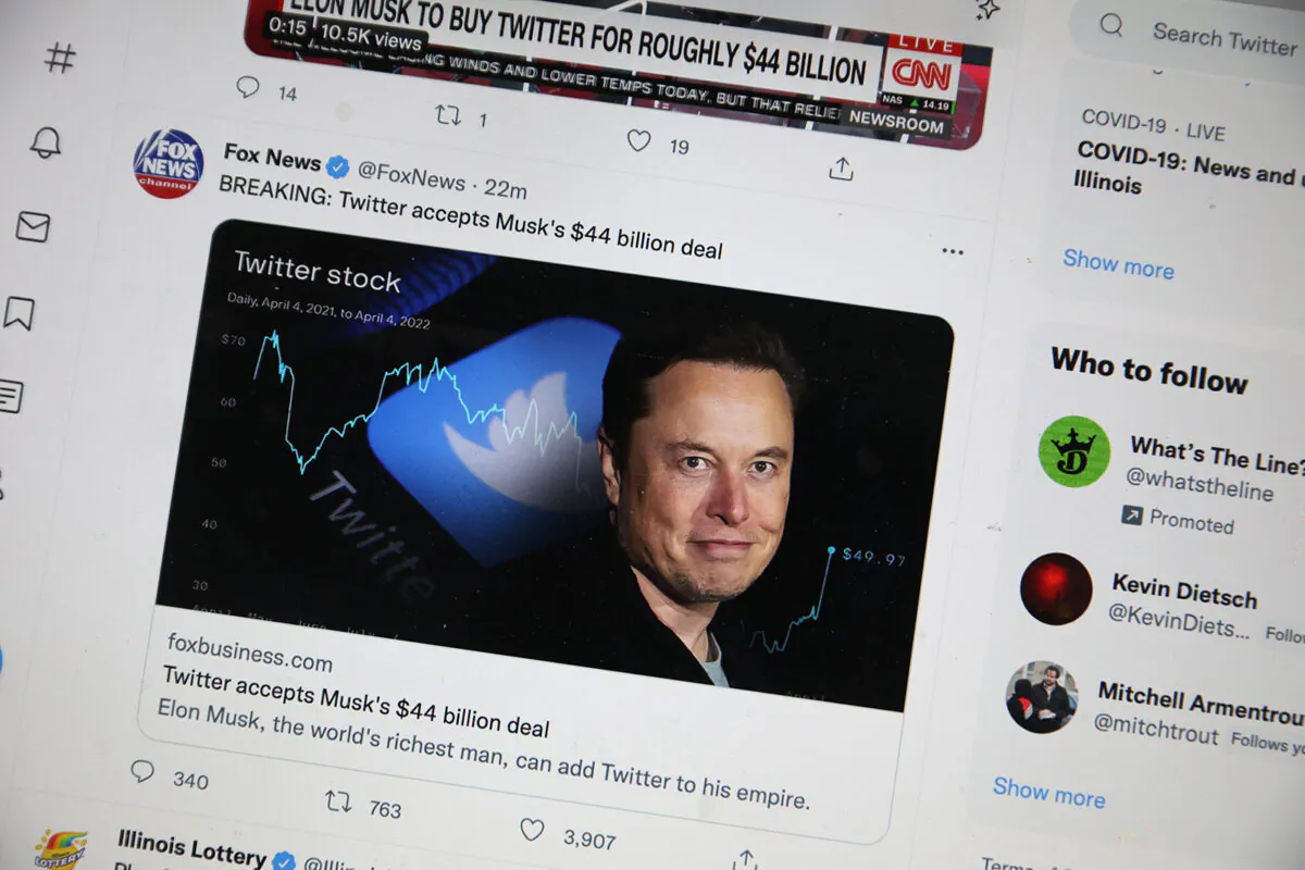 In this photo illustration, news about Elon Musk’s bid to takeover Twitter is posted on Twitter on April 25, 2022. (Scott Olson/Getty Images)