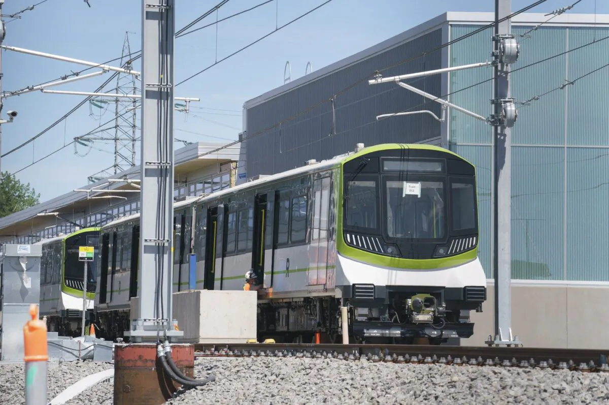 A train is stopped at a station during a media tour of the Réseau express métropolitain, in Brossard, Que., on June 10, 2021. (The Canadian Press/Paul Chiasson)