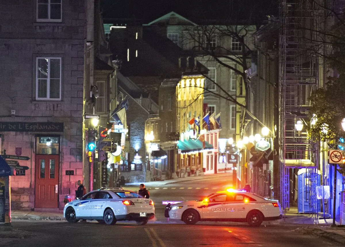 Police cars block St-Louis Street near Le Château Frontenac hotel, early Nov. 1, 2020, in Quebec City. (The Canadian Press/Jacques Boissinot)
