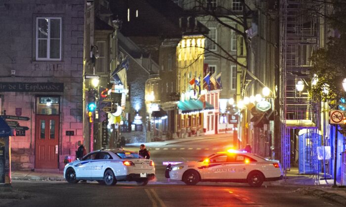 Police cars block St-Louis Street near Le Château Frontenac hotel, early Nov. 1, 2020, in Quebec City. (The Canadian Press/Jacques Boissinot)