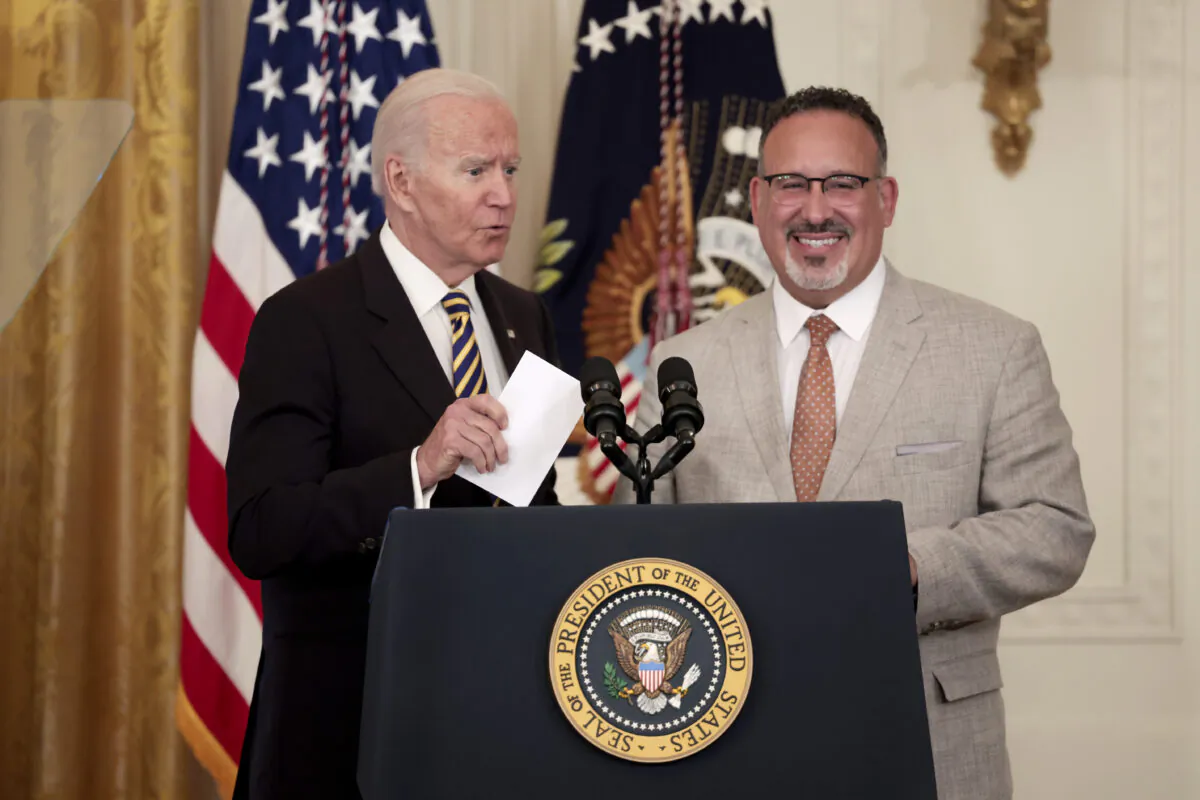 U.S. President Joe Biden and U.S. Education Secretary Miguel Cardona deliver remarks during an event for the 2022 National and State Teachers of the Year in the East Room of the White House on April 27, 2022 in Washington, DC. (Anna Moneymaker/Getty Images)