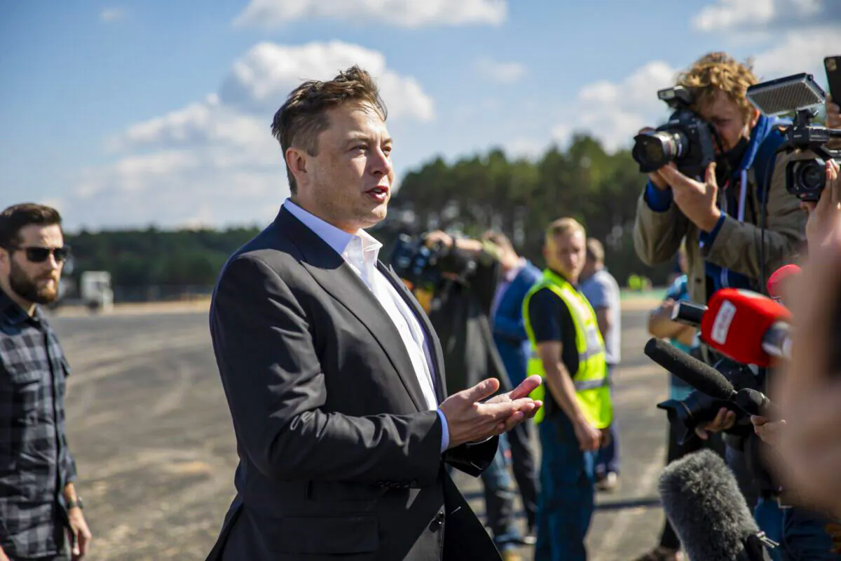 Tesla head Elon Musk talks to the press as he arrives to have a look at the construction site of the new Tesla Gigafactory near Berlin, Germany, on Sept. 3, 2020. (Maja Hitij/Getty Images)