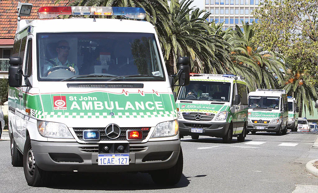 Afghan asylum seekers suffering burns arrive in an ambulance convoy at the emergency section of Royal Perth Hospital in Western Australia on April 17, 2009. (TONY ASHBY/AFP via Getty Images)