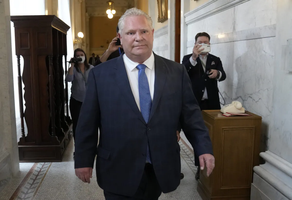 Ontario Premier Doug Ford walks toward Lt.-Gov. Elizabeth Dowdeswell's office at Queen's Park in Toronto on May 3, 2022. Dowdeswell has accepted Ford's suggestion to officially start the provincial election period. (The Canadian Press/Frank Gunn)