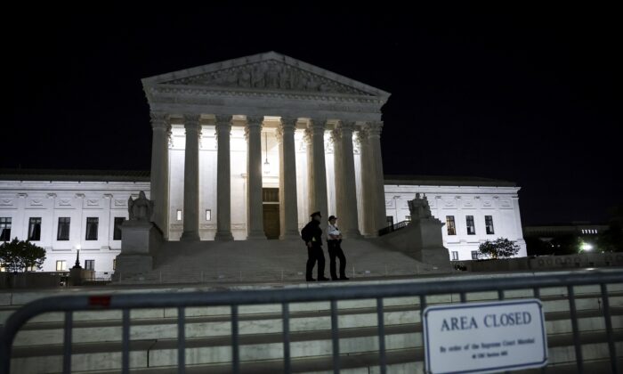 Fencing surrounds the Supreme Court in Washington on May 2, 2022. (Kevin Dietsch/Getty Images)