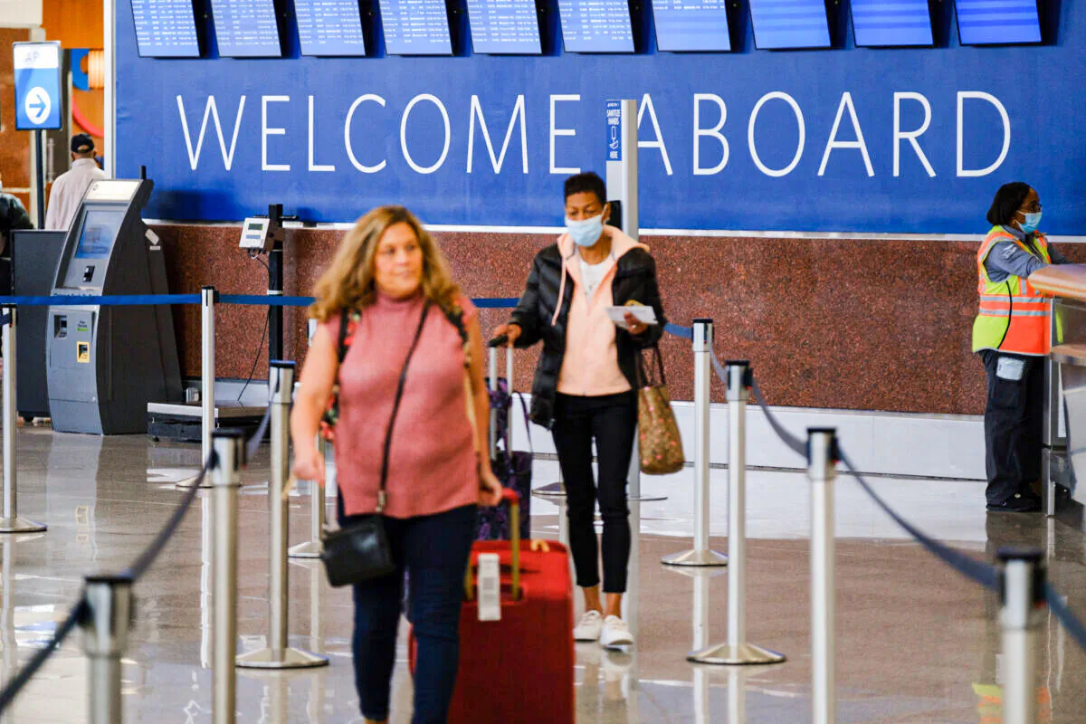 People in the Hartsfield-Jackson International Airport domestic terminal in Atlanta on April 19, 2022. (Arvin Temkar/The Atlanta Journal-Constitution/TNS)