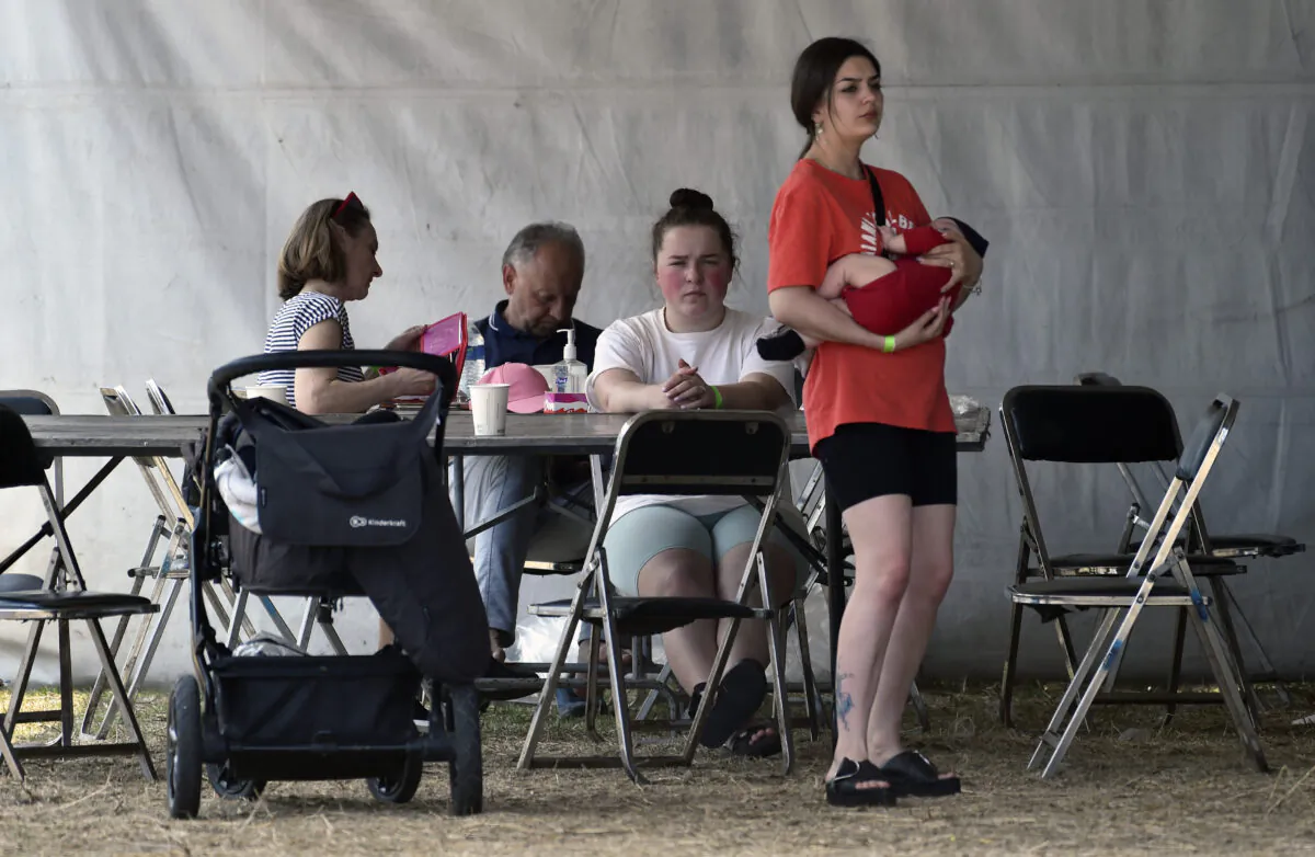 Ukrainians who fled Russia's invasion and are seeking for asylum in the United States rest at a temporary shelter in Mexico City on April 28, 2022. (Alfredo Estrella/AFP via Getty Images)