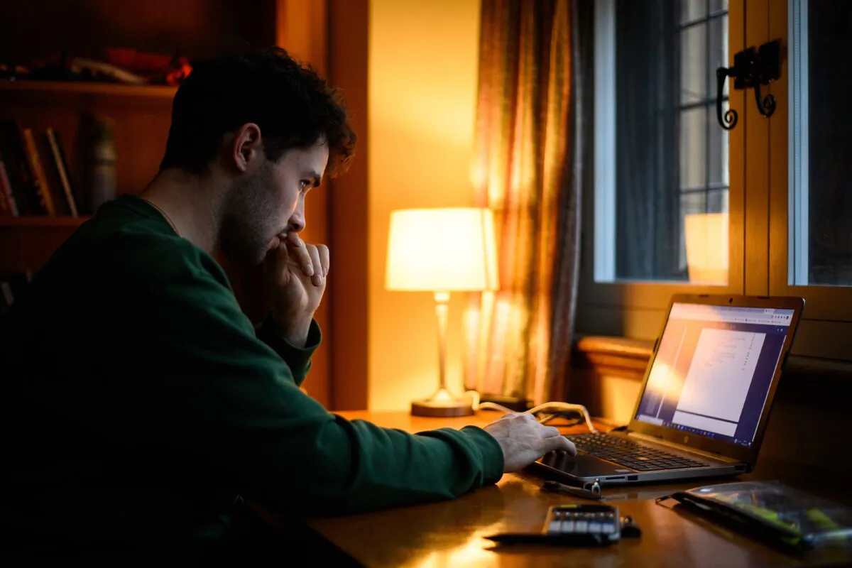 Lucas Strange, 22, continues to study for his degree in physics via online learning sessions from his room in Gonville and Caius College at the University of Cambridge, England, on Jan. 29, 2021. (Leon Neal/Getty Images)