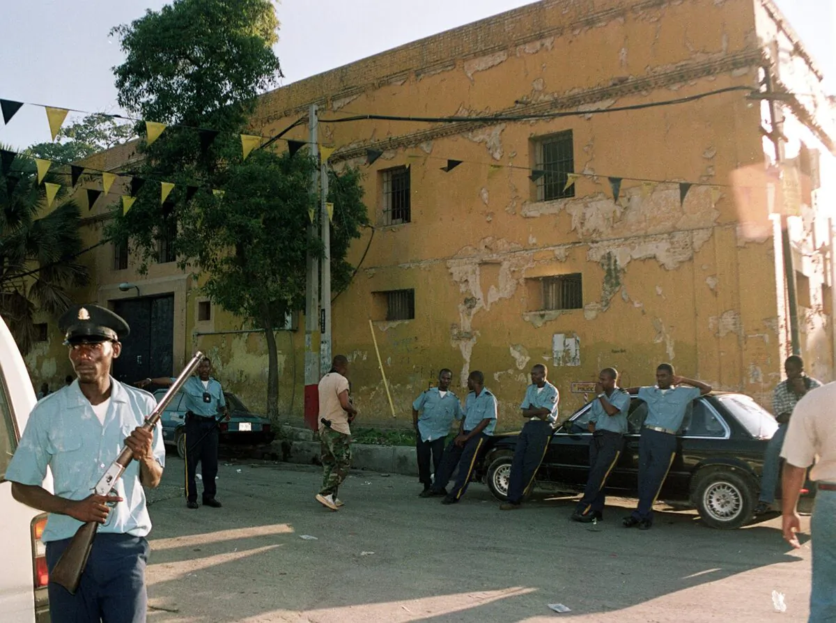 Haiti policeman stand guard after an overnight riot at the National Penitentiary in Port-au-Prince, the largest prison in Haiti, left four inmates dead and two security guards injured. (Thony Belizaire/AFP via Getty Images)