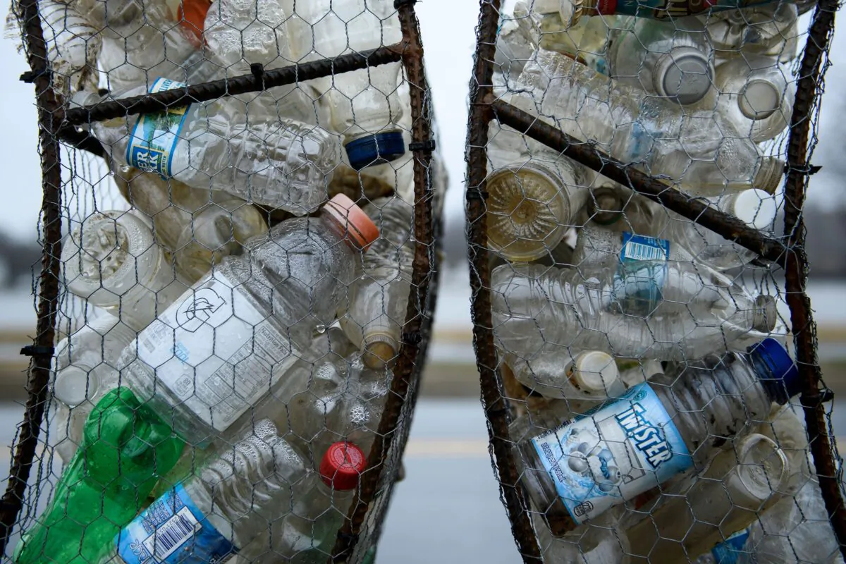 Plastic trash is used to make a sign in Anacostia Park in Wash., on March 21, 2019. (Brendan Smialowski/AFP via Getty Images)