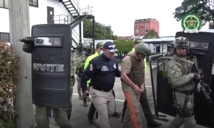 Police escorting Dairo Antonio Úsuga David, in Bogota, Colombia, on May 4, 2022. (Colombian National Police via AP/Screenshot via The Epoch Times)