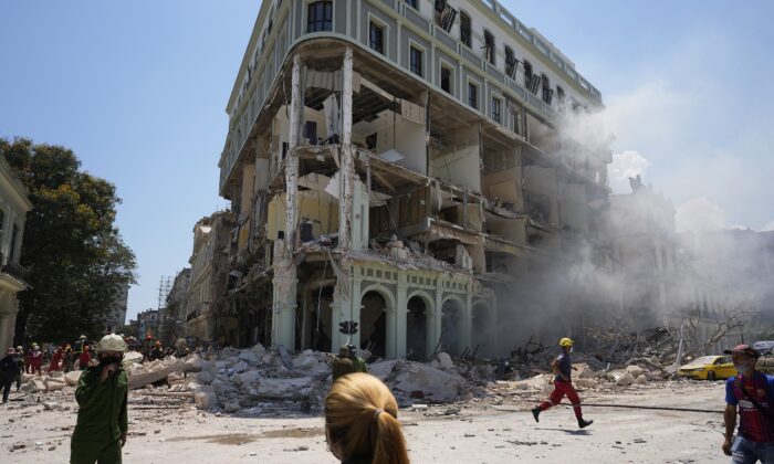 Rooms are exposed at the five-star Hotel Saratoga where emergency crew work after a deadly explosion in Old Havana, Cuba, on May 6, 2022. (Ramon Espinosa/AP Photo)