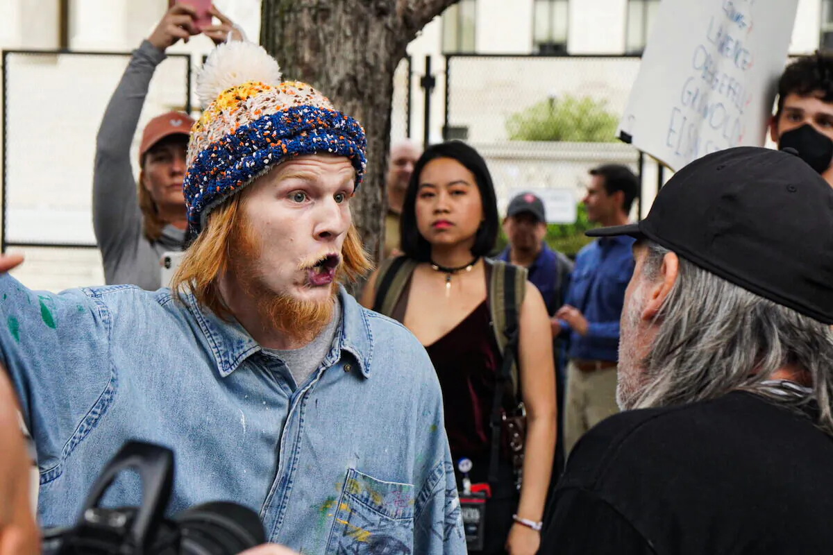 Pro-abortion protester Joseph Price screams at pro-life protestor Joe Green outside the Supreme Court on May 5, 2022 (Jackson Elliott/The Epoch Times)