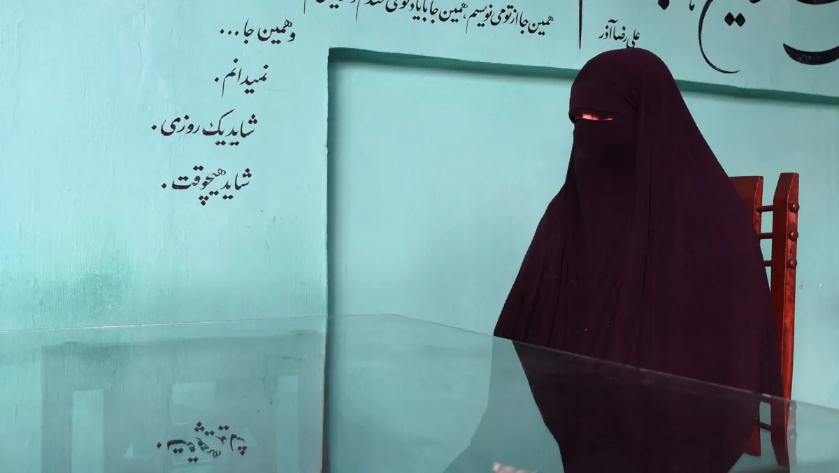 An Afghan mother of six who started begging on the streets after losing her job when her employer fled the country, in Kabul in Nov. 16, 2021. (WAKIL KOHSAR/AFP via Getty Images)