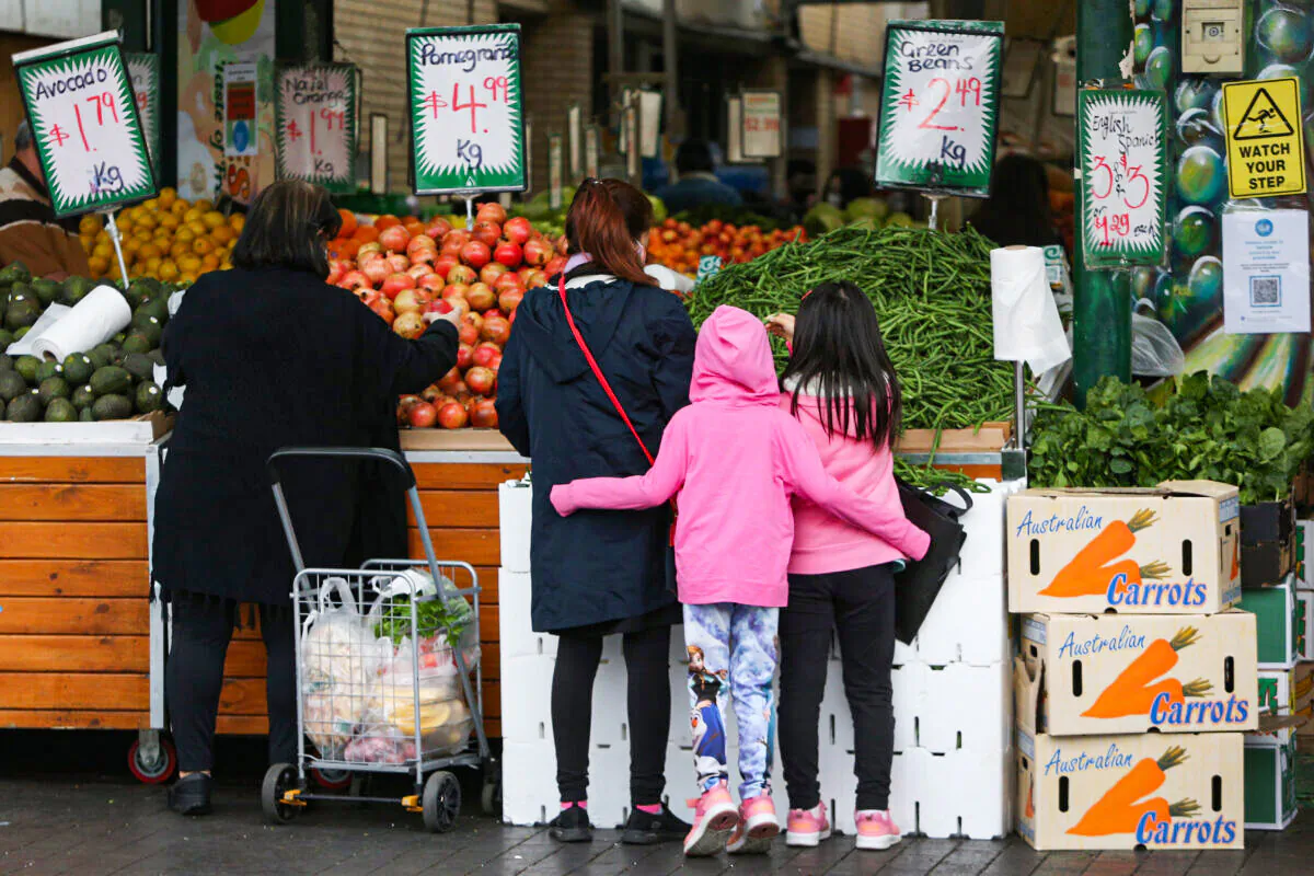 Shoppers gather to buy fruit and vegetables at a store in the suburb of Fairfield in Sydney, Australia, on July 9, 2021. (Lisa Maree Williams/Getty Images)