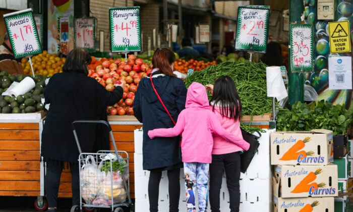 Shoppers gather to buy fruit and vegetables at a store in the suburb of Fairfield in Sydney, Australia, on July 9, 2021. (Lisa Maree Williams/Getty Images)