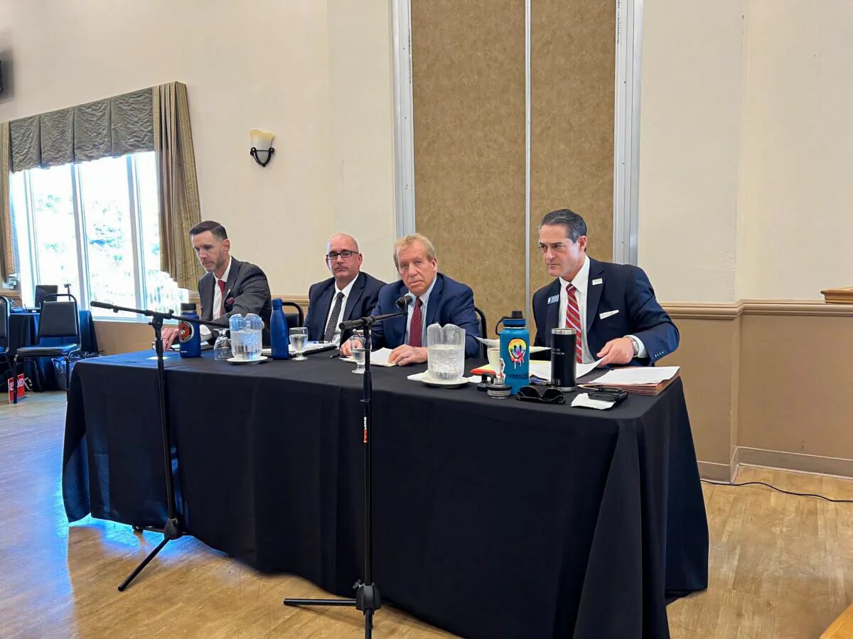 (From L) Pete Hardin, Bryan Chehock, Michael Jacobs, and Todd Spitzer attend a debate, vying for the office of the Orange County District Attorney in Fullerton, Calif., on May 4, 2022. (Drew Van Voorhis/The Epoch Times)