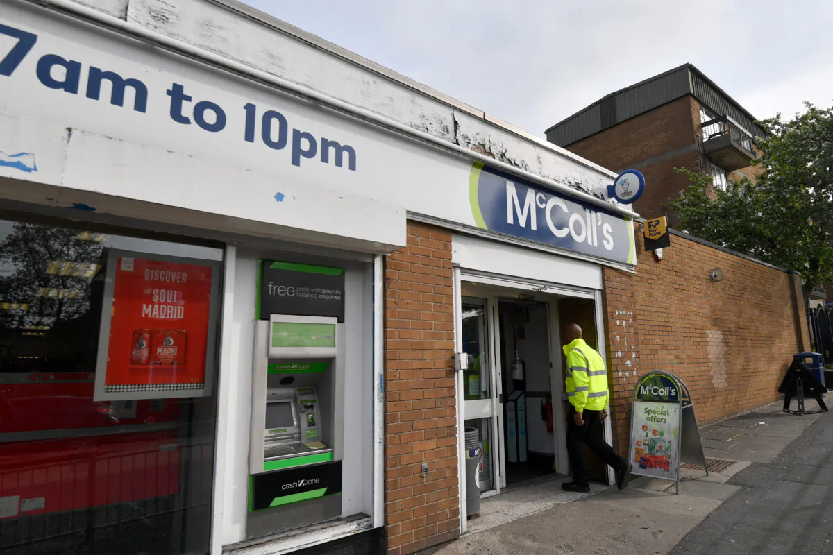 A man enters a McColls store in Dukinfield, England on May 6, 2022. (Anthony Devlin/Getty Images)