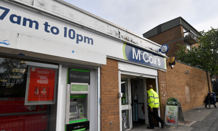 A man enters a McColls store in Dukinfield, England on May 6, 2022. (Anthony Devlin/Getty Images)