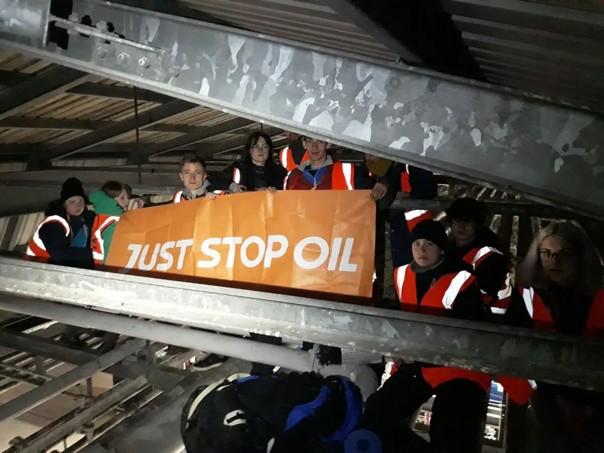 Climate activists from Just Stop Oil blockade the Nustar Clydebank oil terminal in West Dunbartonshire, Scotland, on May 3, 2022. (Just Stop Oil/PA Media)