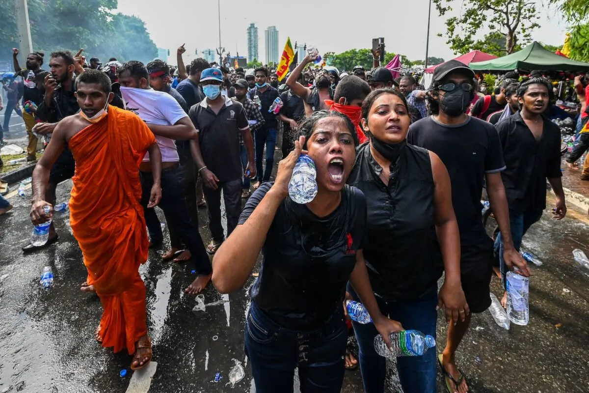 University students take part in a demonstration demanding the resignation of Sri Lankan President Gotabaya Rajapaksa over the country's crippling economic crisis, near the parliament building in Colombo, Sri Lanka, on May 6, 2022. (Ishara S. Kodikara/AFP via Getty Images)