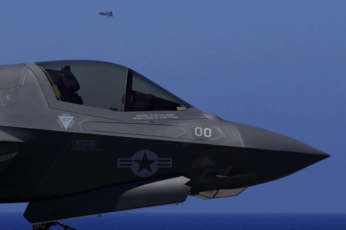 F-35 aircraft fly over the U.K.'s aircraft carrier HMS Queen Elizabeth in the Mediterranean Sea on June 20, 2021. (The Canadian Press/AP-Petros Karadjias)