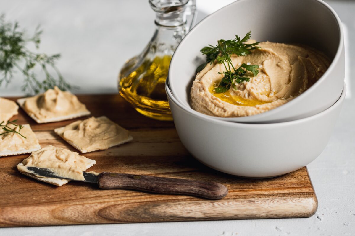 This hummus is a wonderful addition to seed crackers, tortilla chips, pita chips, and vegetables (Photo by Anna Pyshniuk/Pexels)