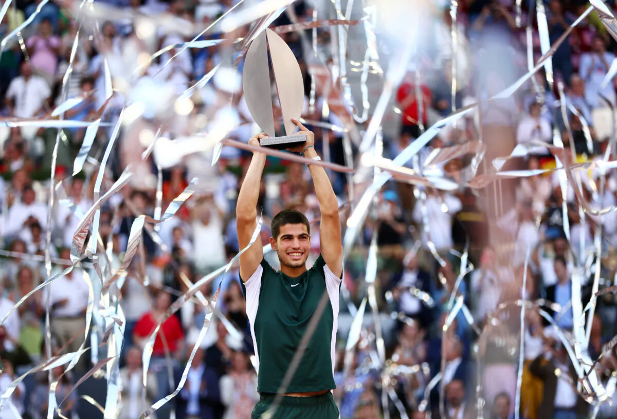 Carlos Alcaraz of Spain lifts the Men's Singles Winner Mutua Madrid Open trophy after his victory in the men's singles final match at La Caja Magica in Madrid, Spain, on May 08, 2022. (Clive Brunskill/Getty Images)