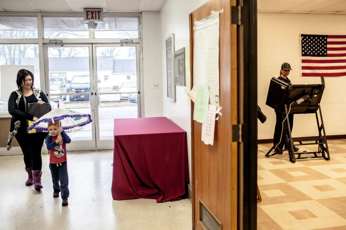 A voter casts her ballot at the polling location inside the county's courthouse building on March 1, 2016 in Marion, Arkansas. (Photo by Andrea Morales/Getty Images)