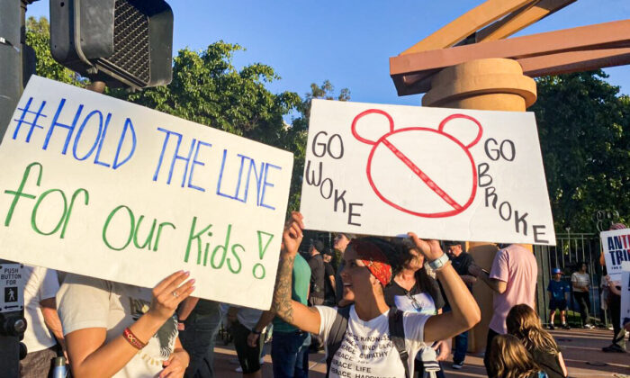 Protesters rally in opposition to The Walt Disney Company's stance against a recently passed Florida law outside of the company's headquarters in Burbank, Calif., on April 6, 2022. (Jill McLaughlin/The Epoch Times)