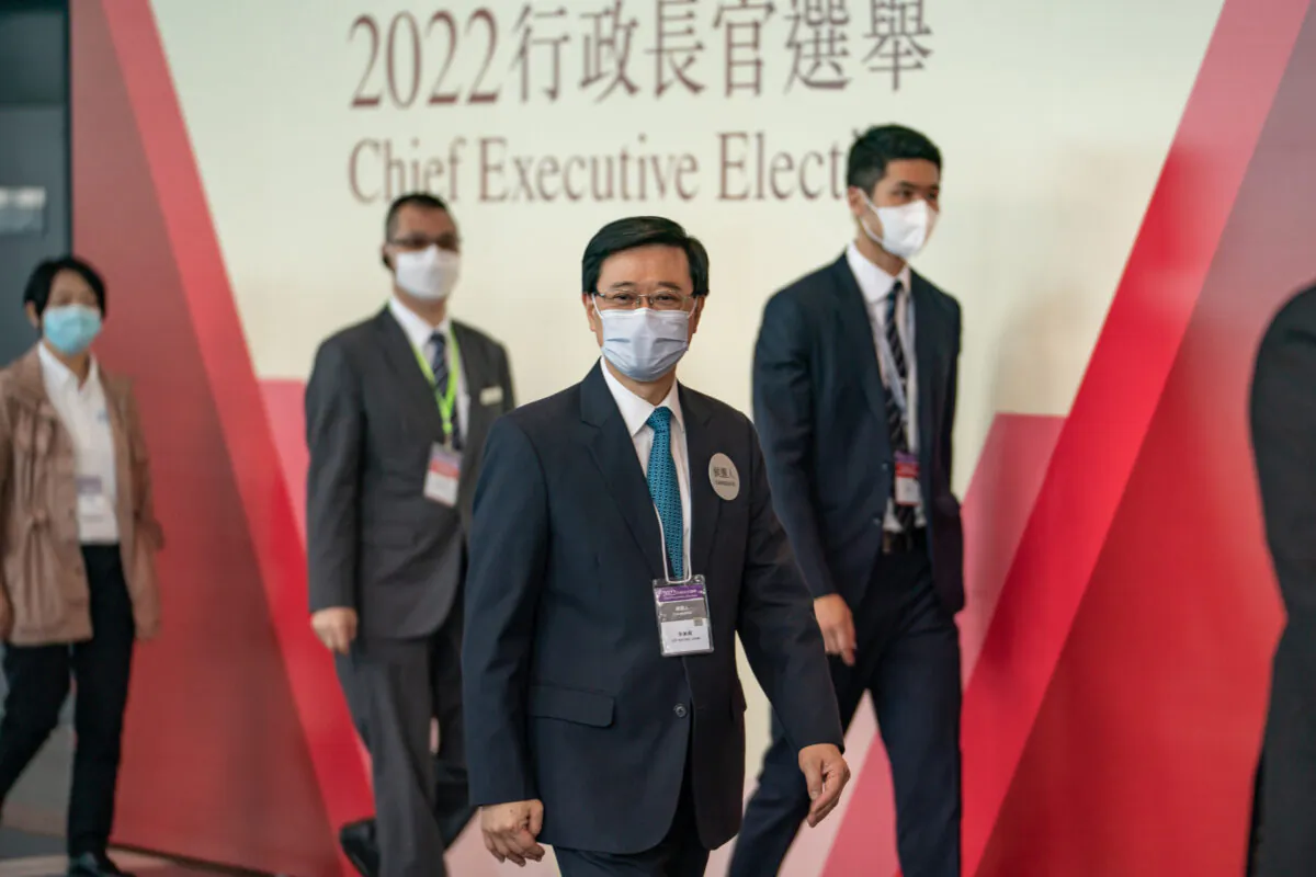 Hong Kong Chief Executive candidate Lee Ka-chiu arrives to greet the Election Committee members at the Exhibition and Convention Centre in Hong Kong on May 8, 2022. (Anthony Kwan/Getty Images)
