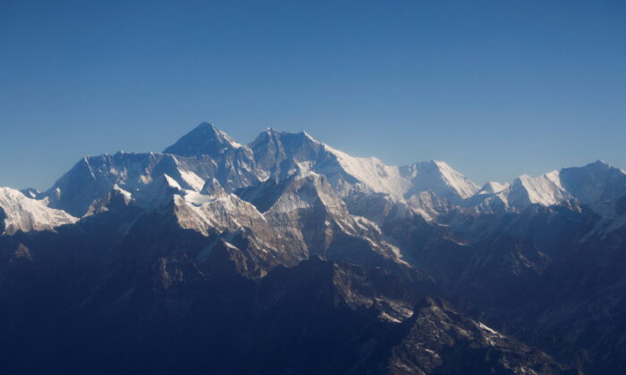 Mount Everest, the world highest peak, and other peaks of the Himalayan range are seen through an aircraft window during a mountain flight from Kathmandu, Nepal on Jan. 15, 2020. (Monika Deupala/Reuters)