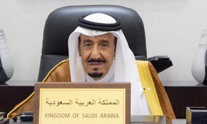 Saudi King Salman attends the G20 Leaders' Summit via videoconference at the royal palace in Riyadh, Saudi Arabia, on Oct. 30, 2021. (Bandar Aljaloud/Saudi Royal Palace via AP)