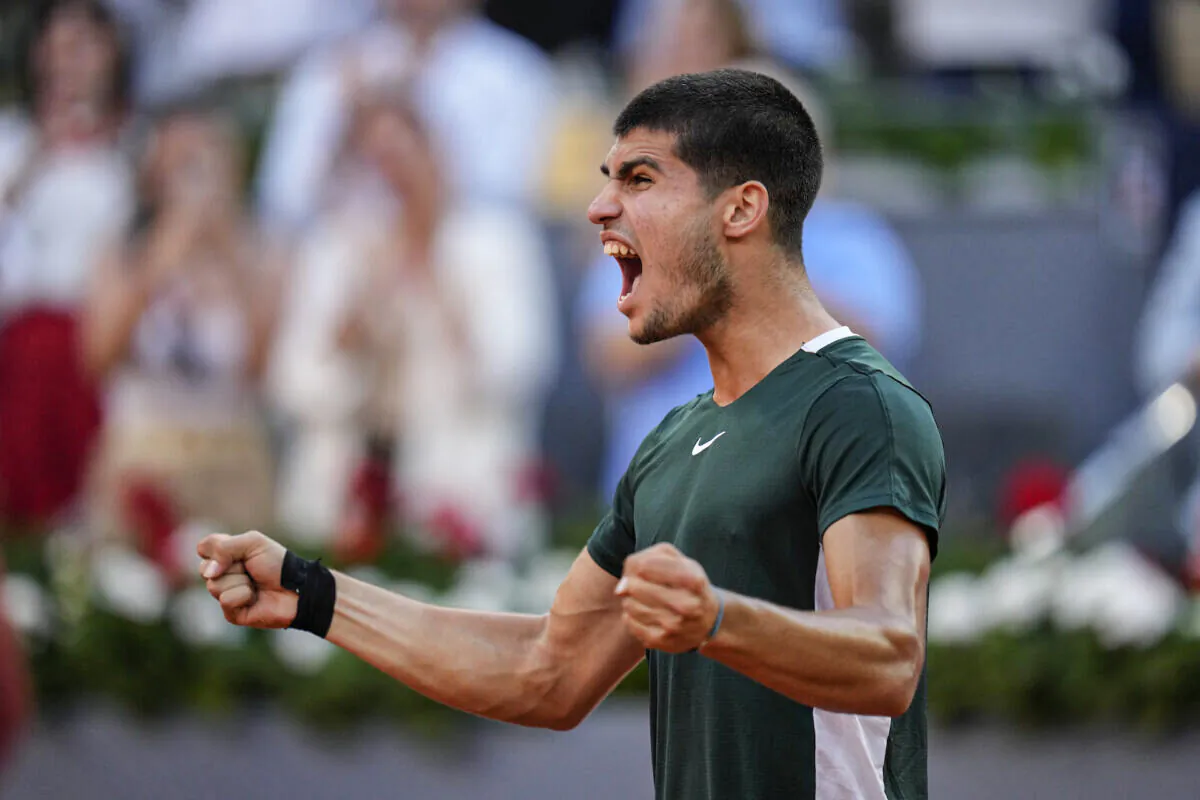 Carlos Alcaraz celebrates after defeating Novak Djokovic during a men's semifinal at the Mutua Madrid Open tennis tournament in Madrid, Spain, May 7, 2022. (Manu Fernandez/AP Photo)